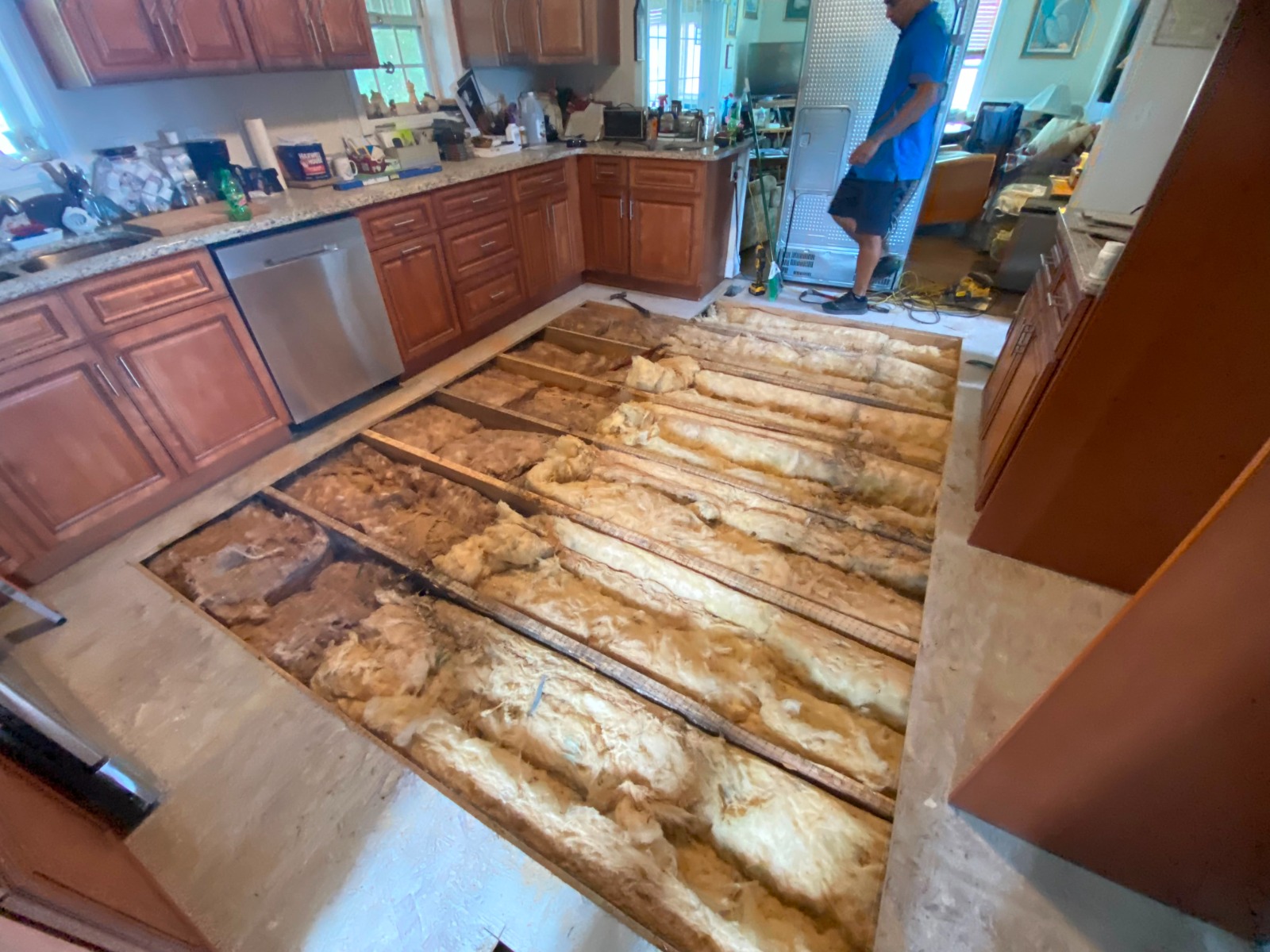 Kitchen floor structure exposed before repair by Handysam