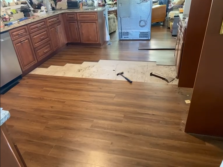 New kitchen flooring being installed by Handysam
